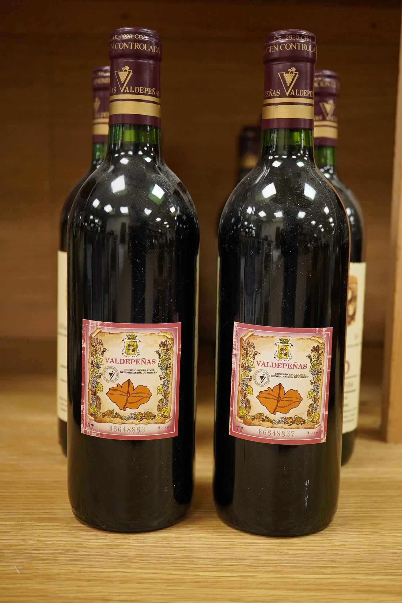 An early 20th century carved oak mantel clock, with key and pendulum, 58cm high